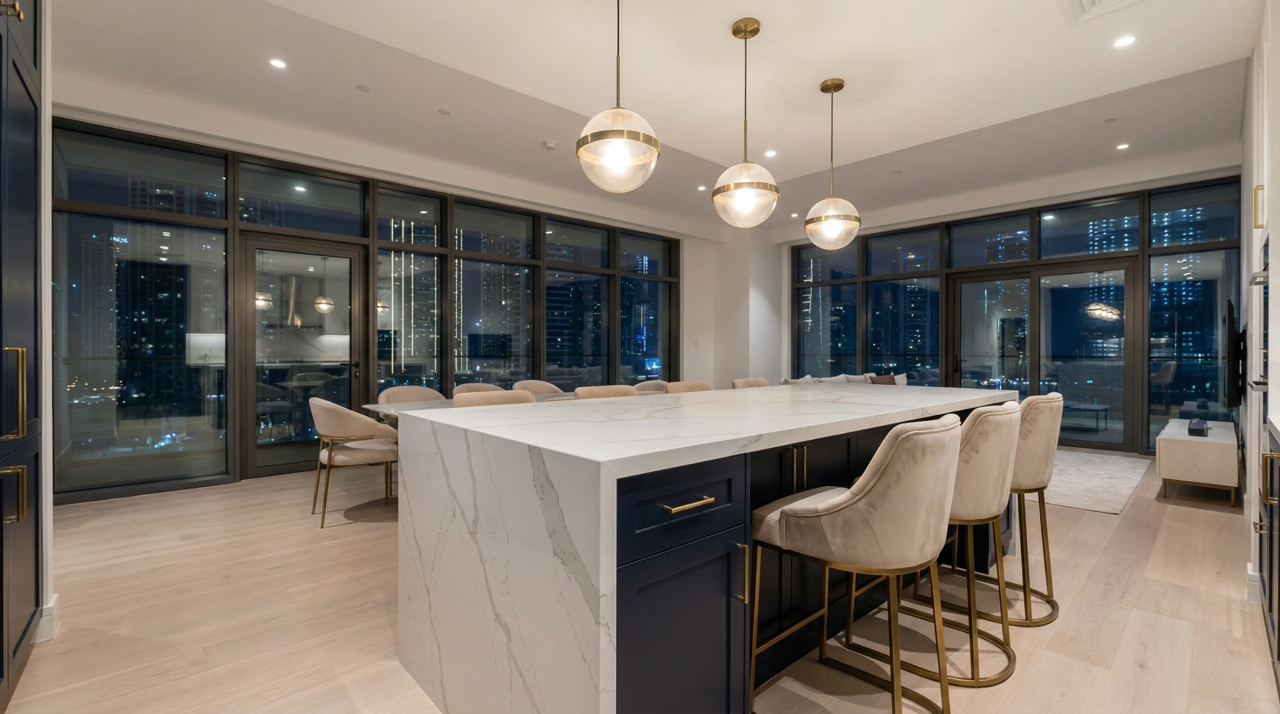 Custom luxury kitchen island with waterfall countertop in Dubai home
