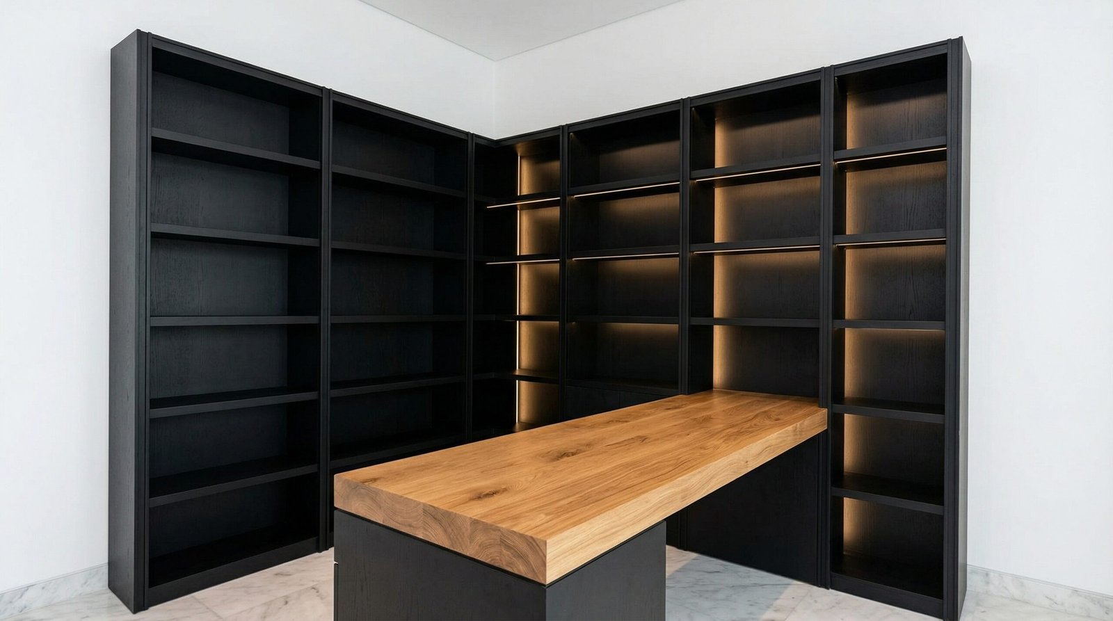 Complete Built In Home Study With Matte Black Bookshelves And Oak Wood Desk In A Dubai Villa.