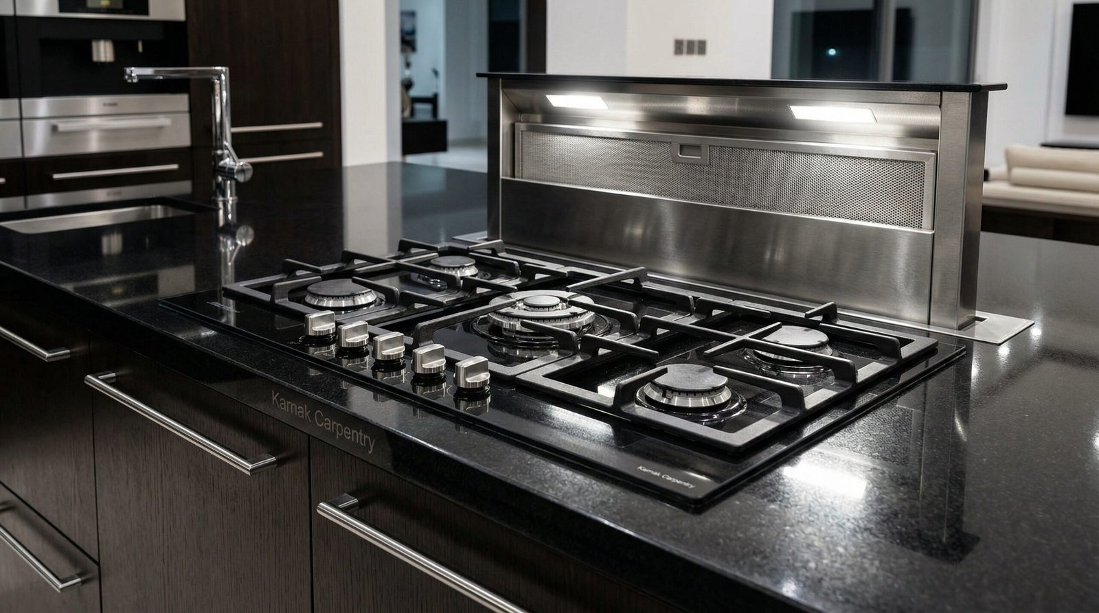 High-performance kitchen island with a flush-mounted gas hob and a powerful integrated downdraft extractor, Jumeirah Islands villa.