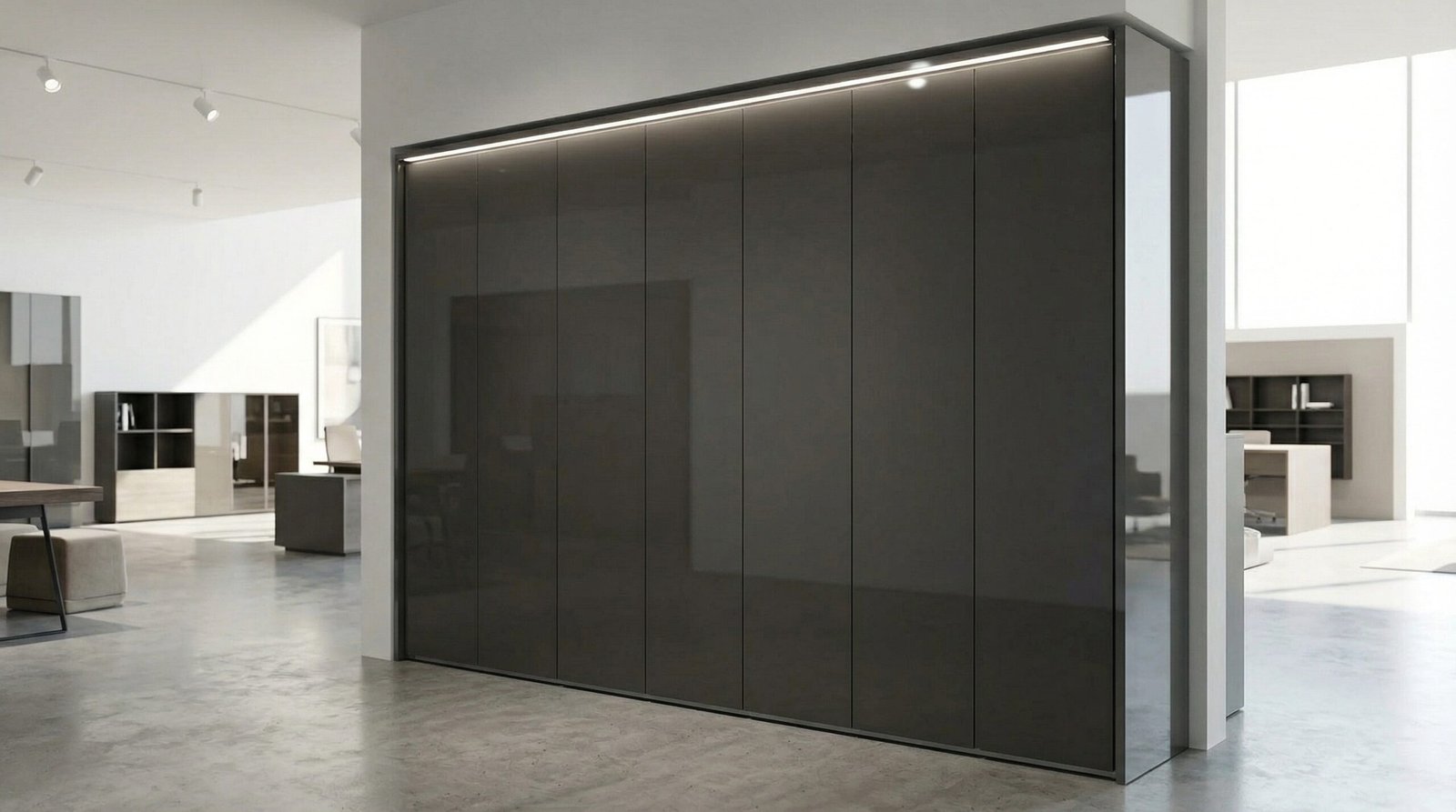 Contemporary minimalist handleless wardrobe in high-gloss anthracite lacquer with LED pelmet displayed in Karnak Carpentry Dubai showroom UAE