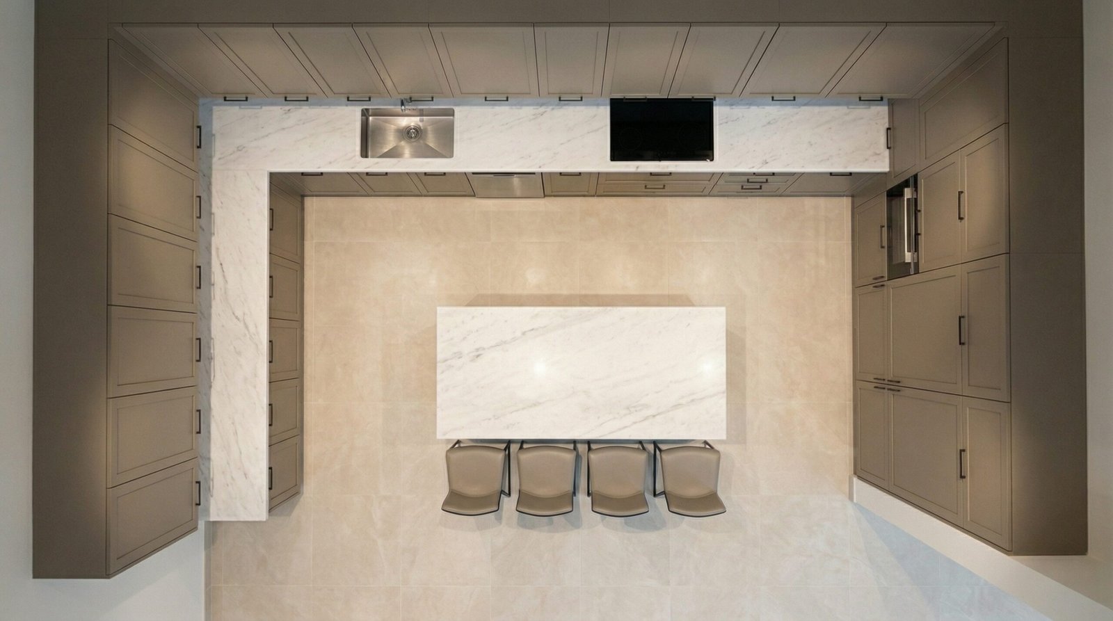 Overhead bird's-eye view of custom greige kitchen cabinet installation with island and marble countertop in UAE apartment
