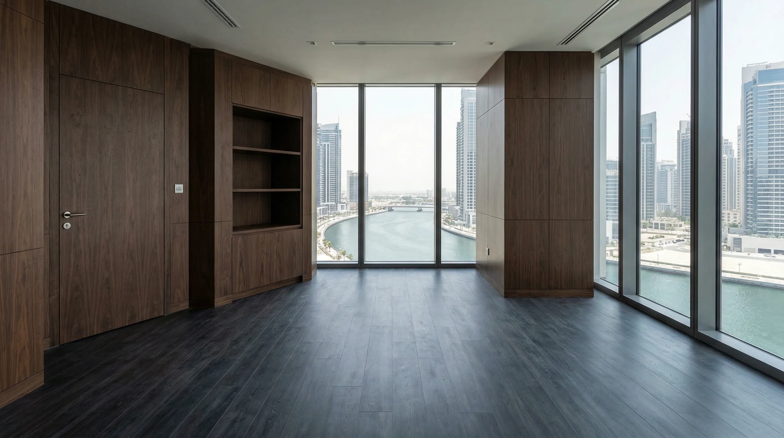 Sophisticated dark slate-effect SPC flooring in an executive office in Business Bay by Karnak Carpentry.
