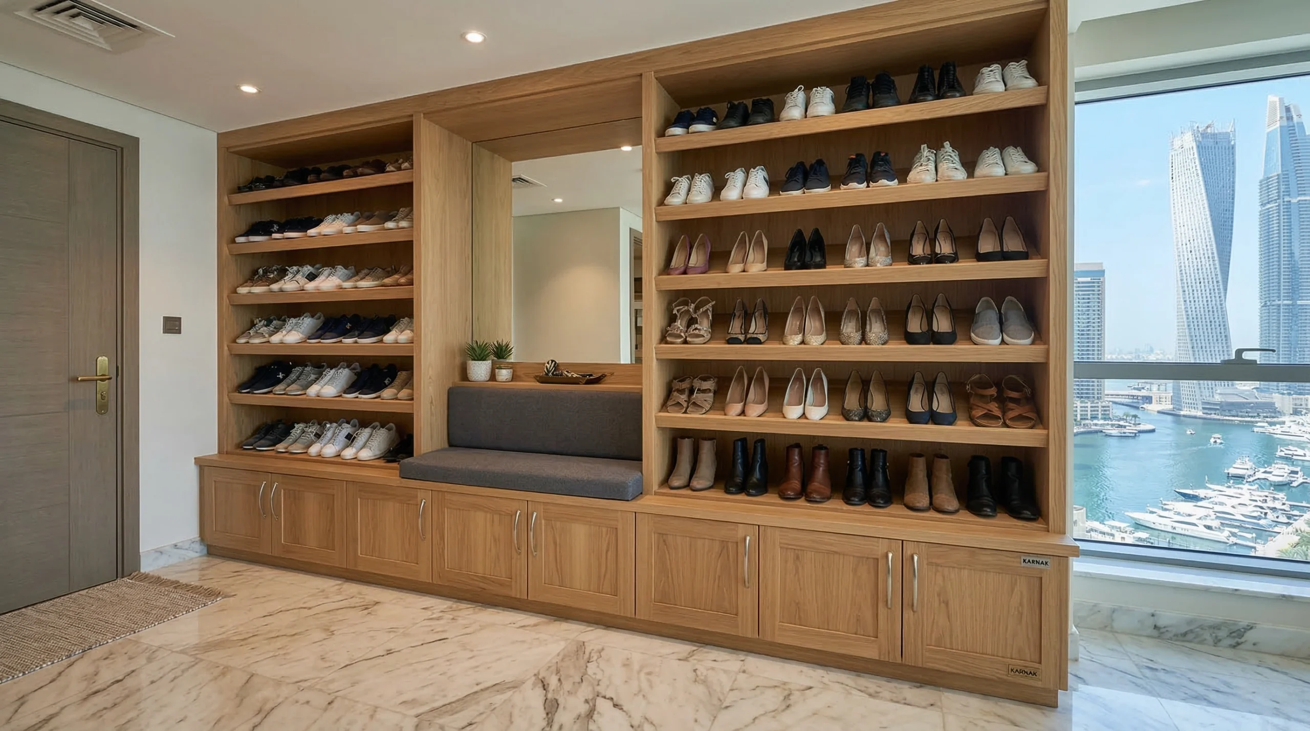 Floor-to-ceiling fitted oak shoe rack with bench seat and slanted shelves in Dubai Marina apartment entryway By Karnak Carpentry