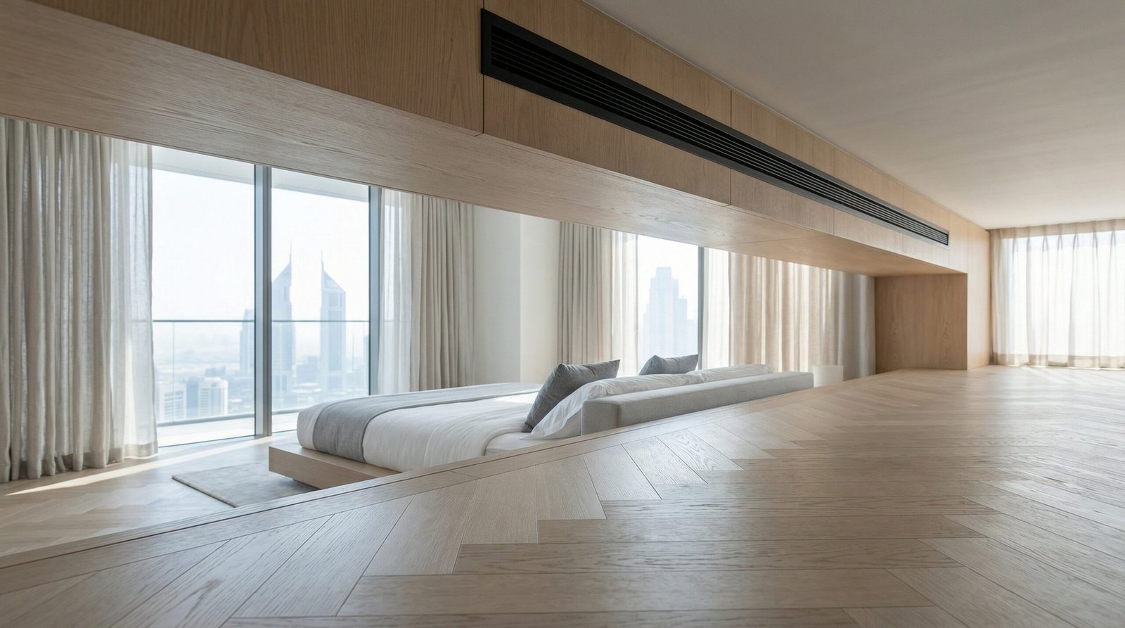 Light oak matte parquet flooring in a cool air-conditioned modern Dubai penthouse bedroom.