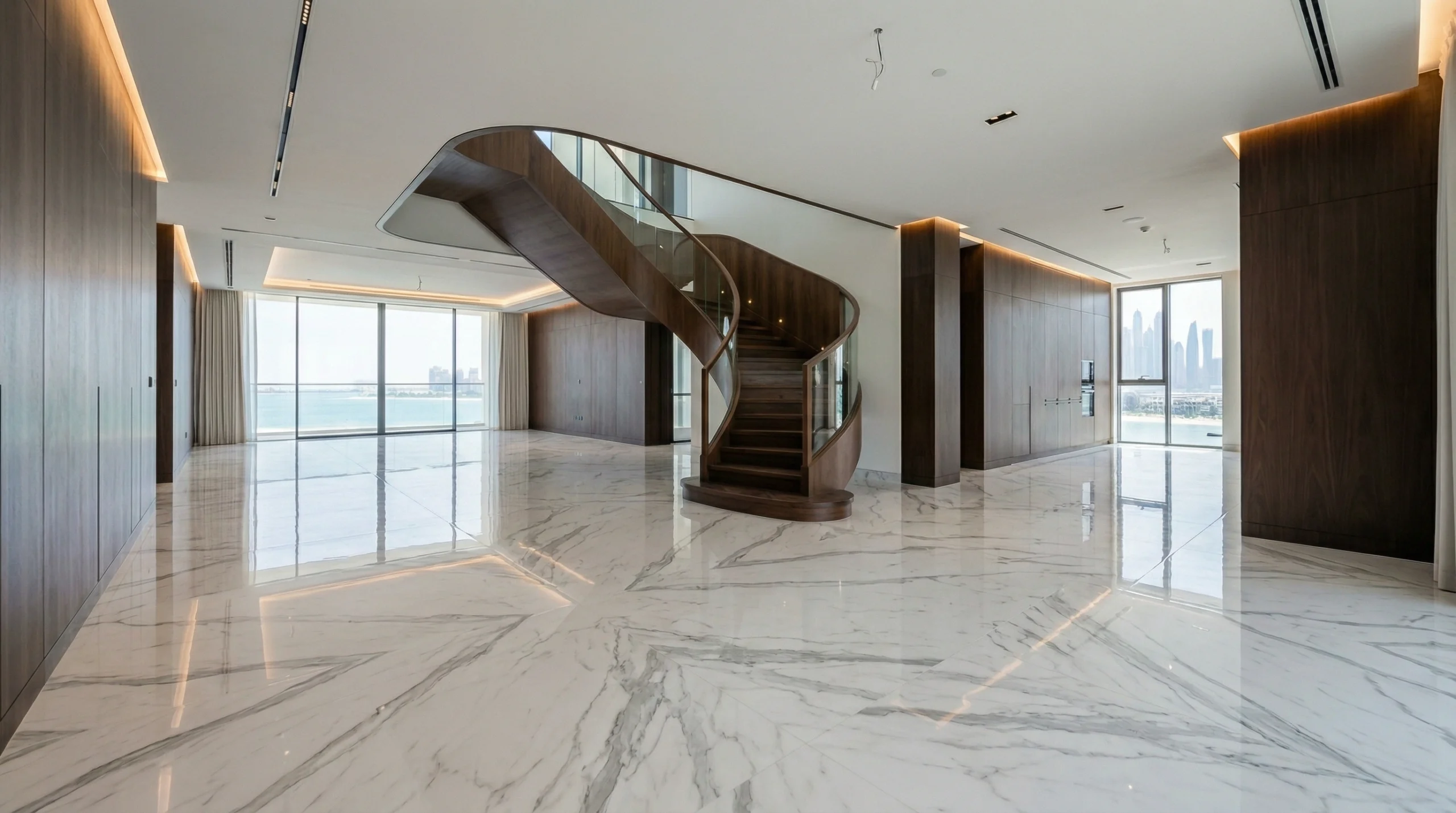Seamless high-gloss marble-effect SPC flooring integrated with custom joinery in a luxury Palm Jumeirah villa.