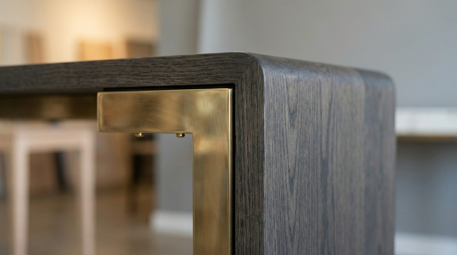 Detailed shot of brass and smoked oak joinery on a custom Karnak console table.