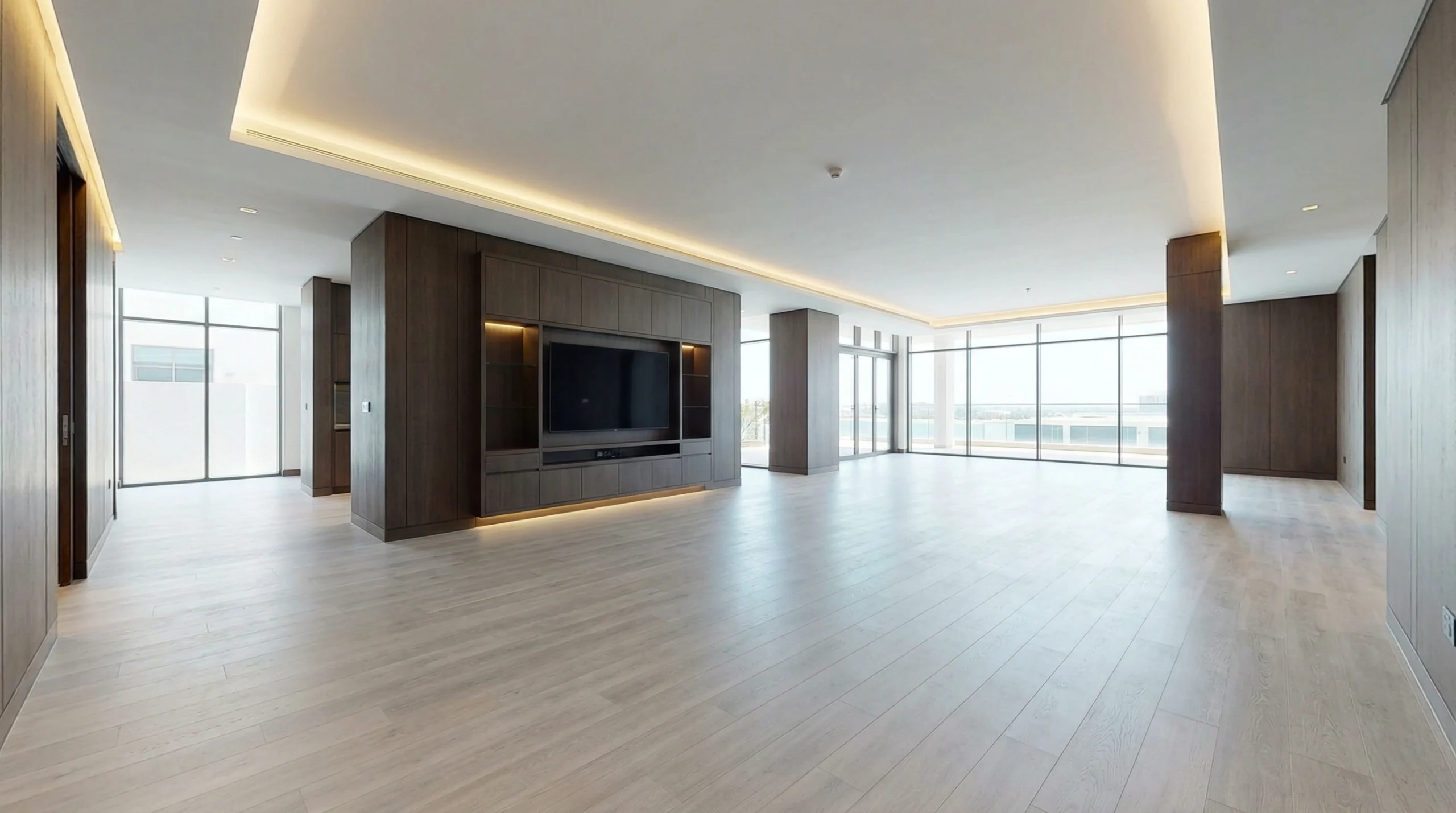 Premium light grey oak SPC flooring installed across a large Palm Jumeirah villa ground floor by Karnak Carpentry