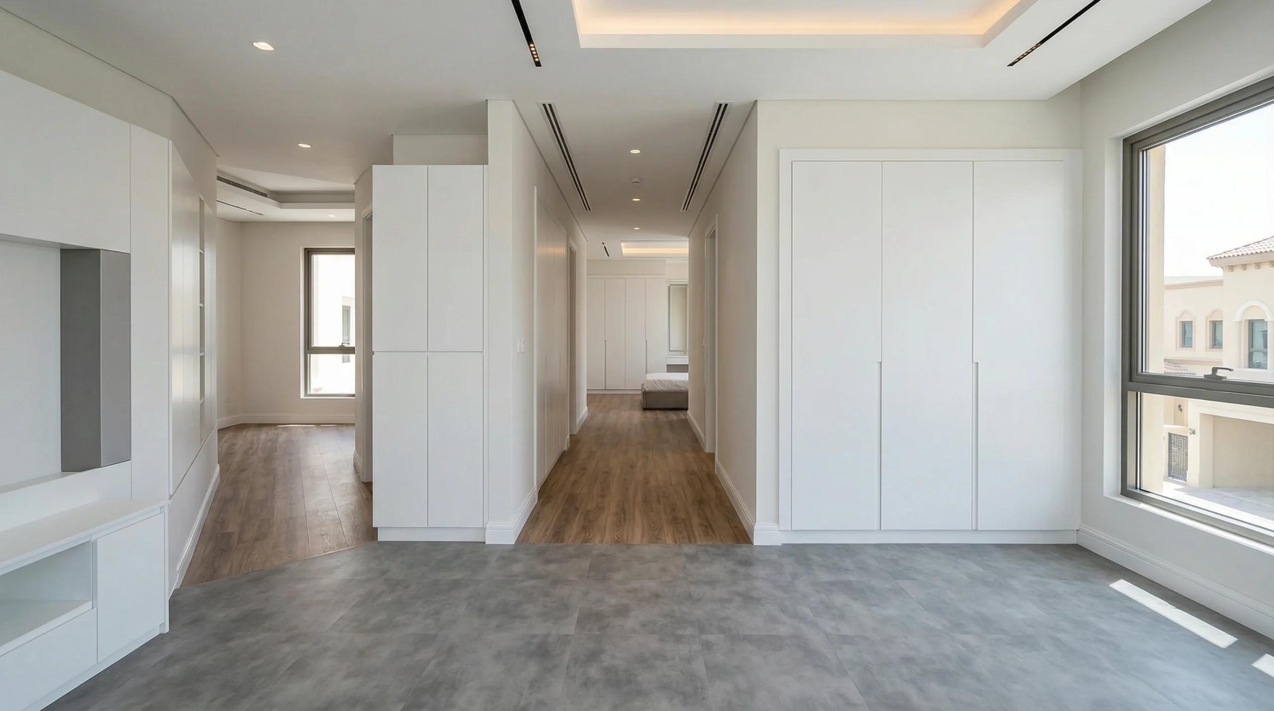 Seamless grey and wood-grain LVT flooring throughout a modern Victory Heights townhouse with custom joinery.
