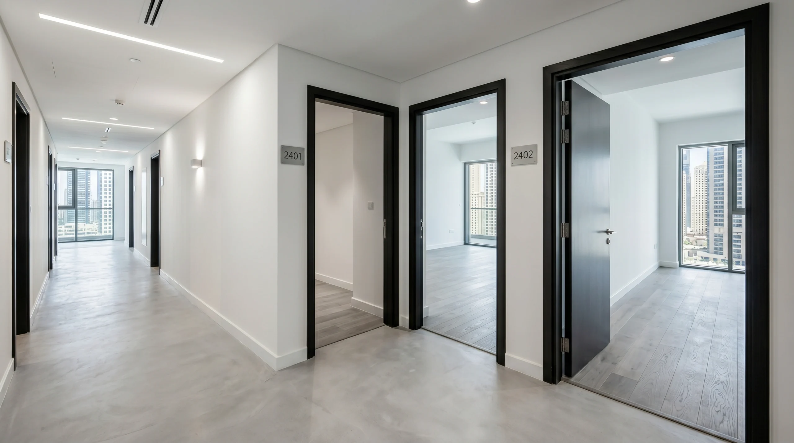 Consistent engineered oak flooring installed uniformly across multiple Dubai Marina apartment tower units visible through sequential open doorways