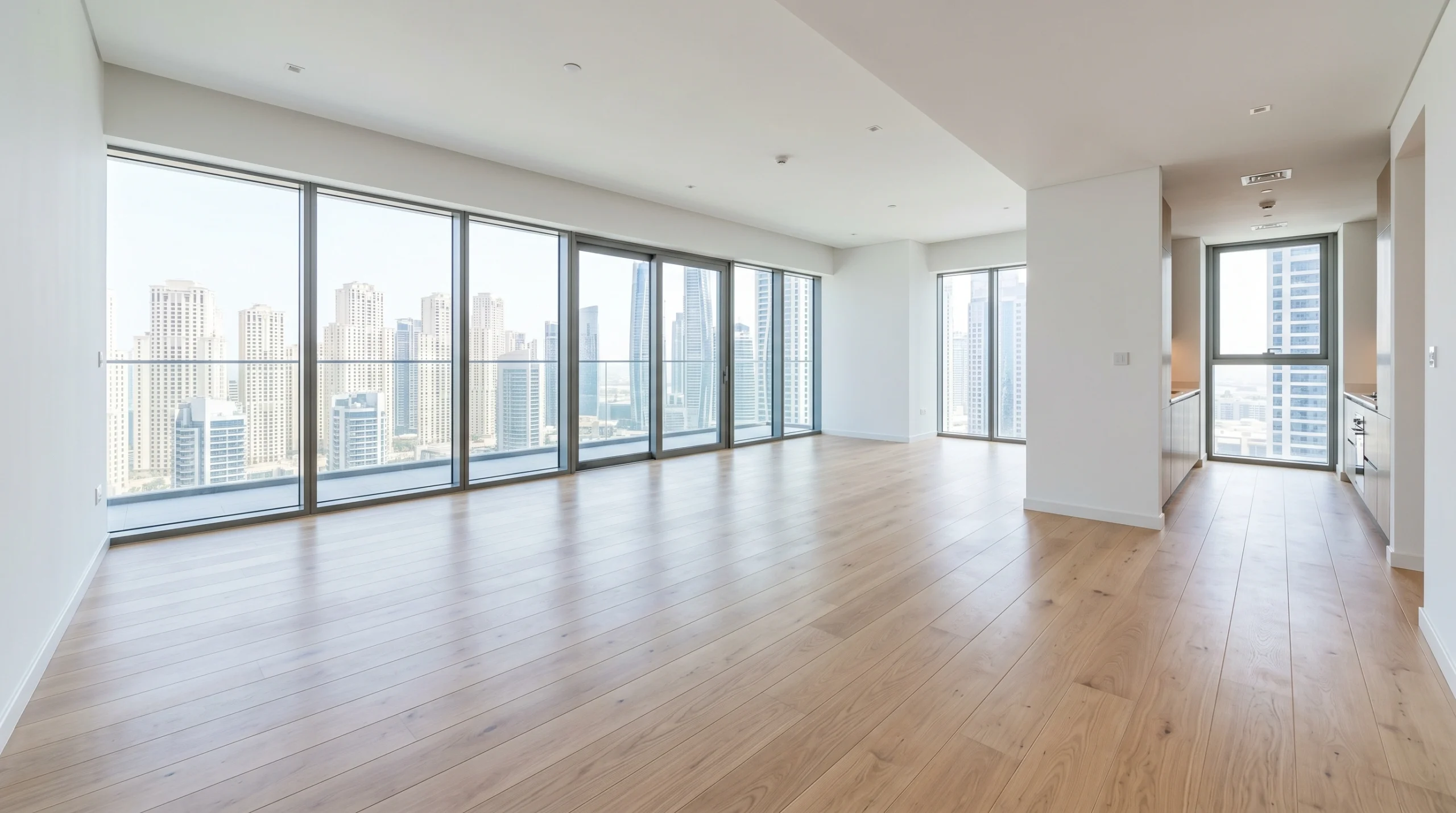 Premium wide-plank European white oak flooring installed throughout high-floor Dubai apartment enhancing property market value and appeal