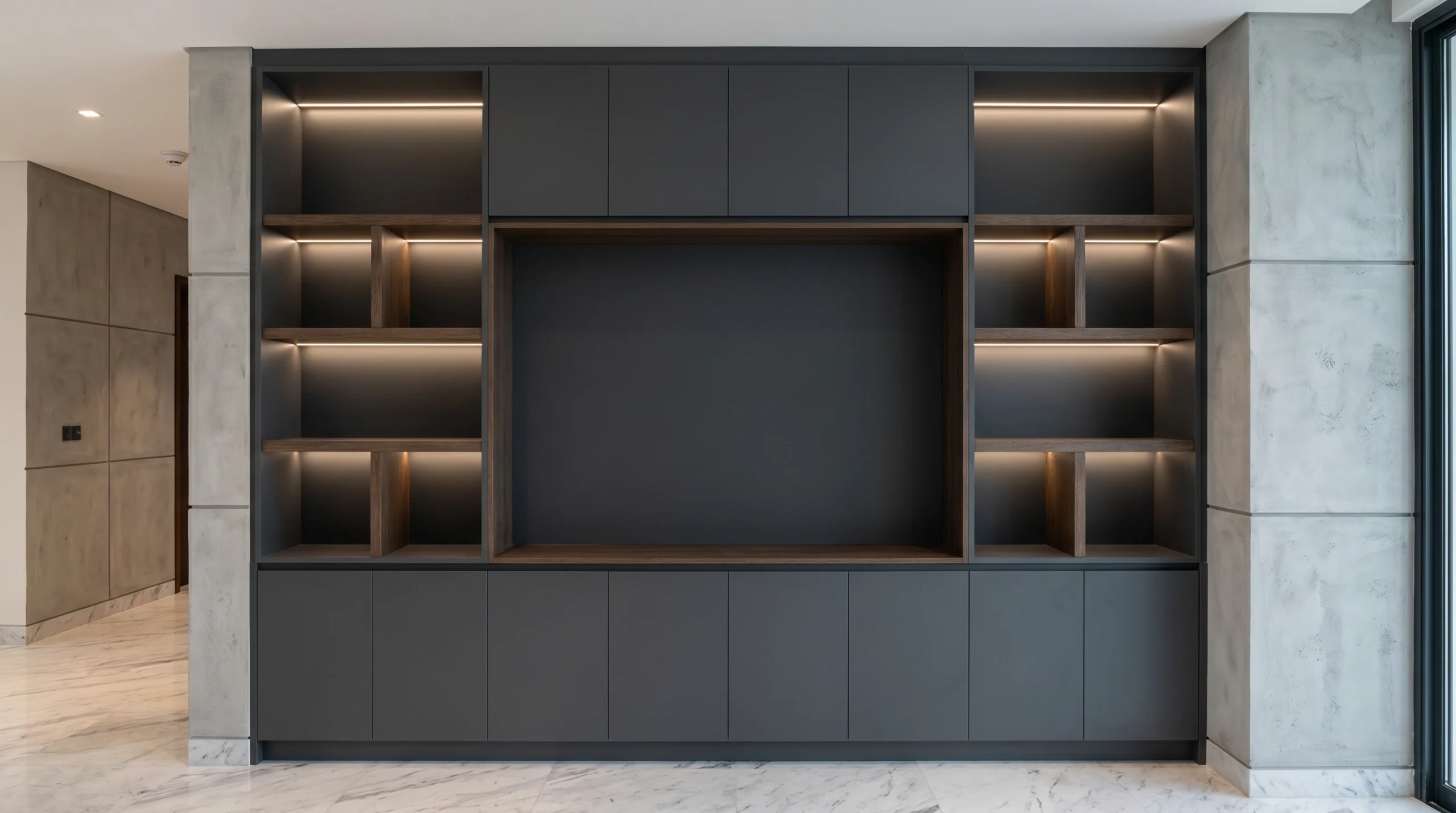 Modern built-in TV unit Dubai, custom charcoal joinery, media wall installation Jumeirah villa, Karnak Carpentry.