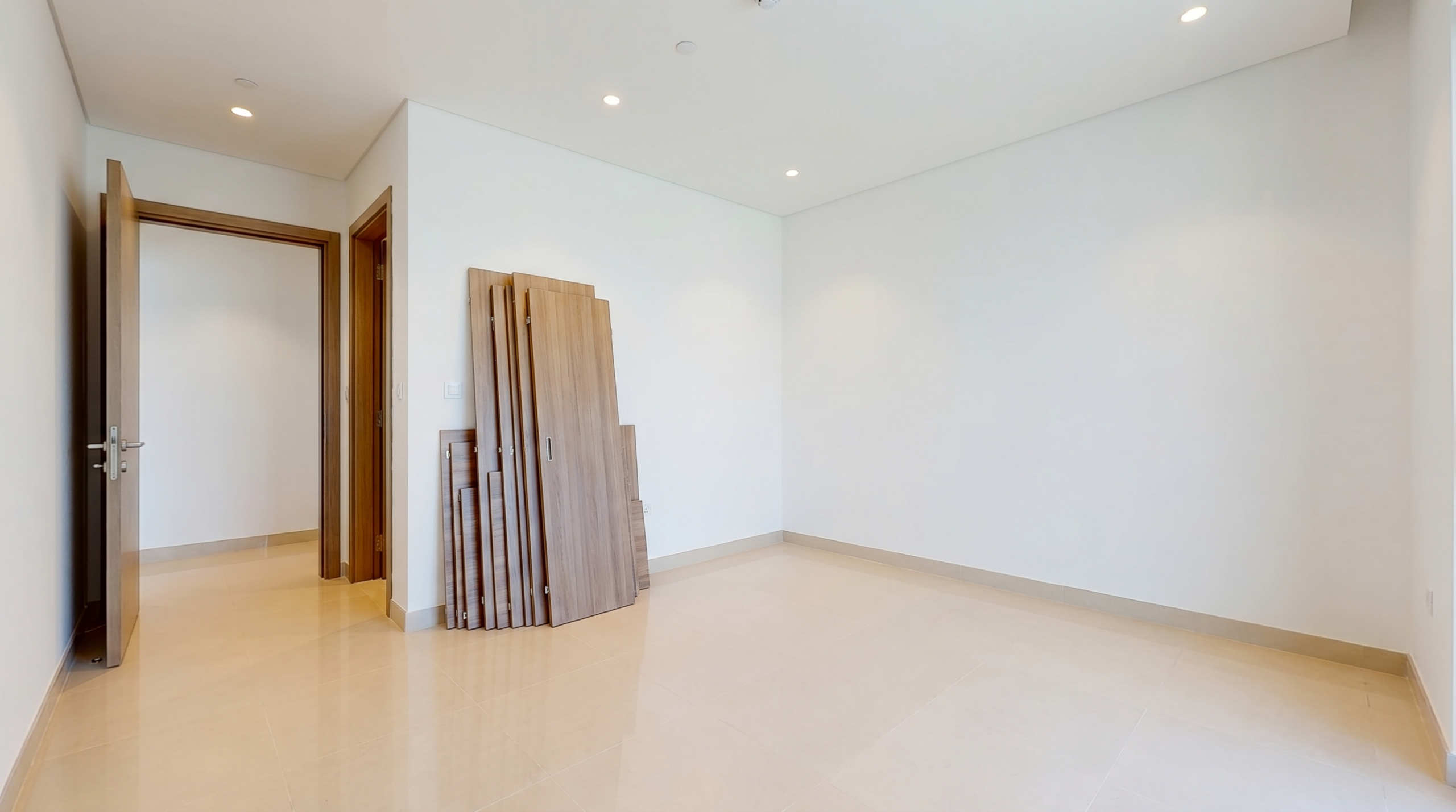Empty Dubai bedroom prepared and cleared for fitted wardrobe installation